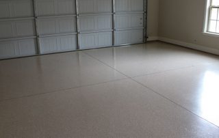 This image shows a garage with a flake epoxy-painted floor.