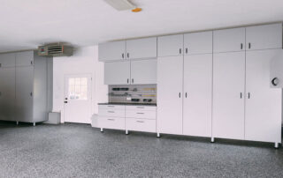 This image shows a white garage cabinet.